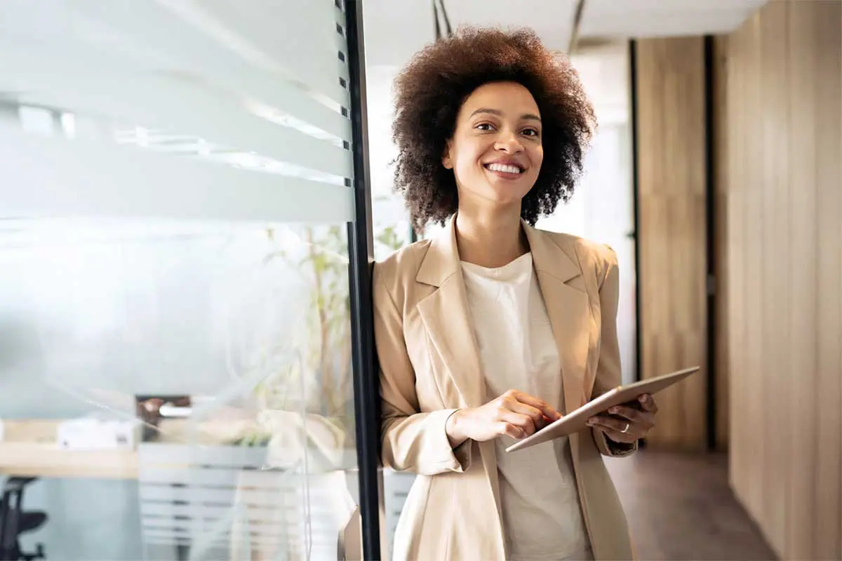 Woman Standing in front of office for core banking software