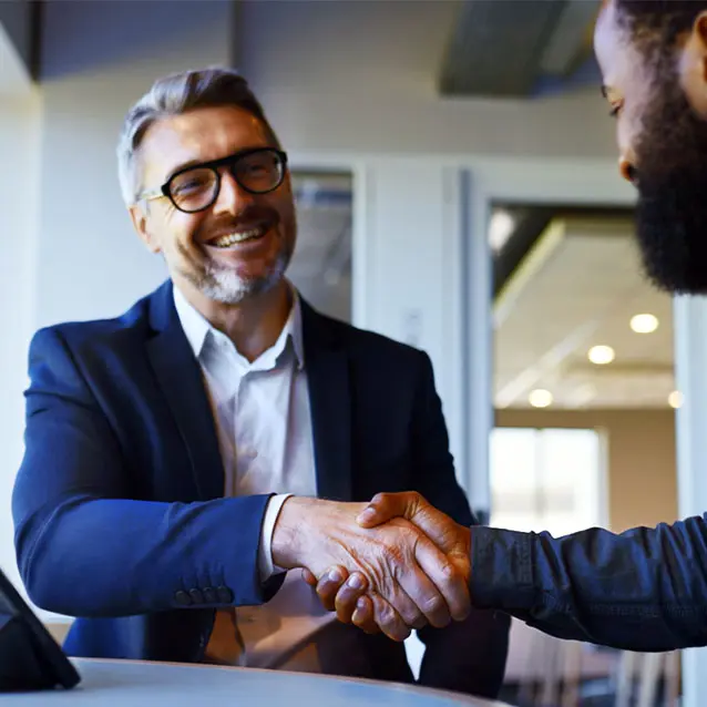 Man shaking hands on a credit union deal