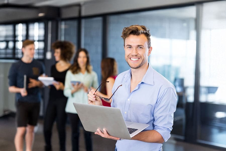 Man holding laptop with portfolio+ term deposit